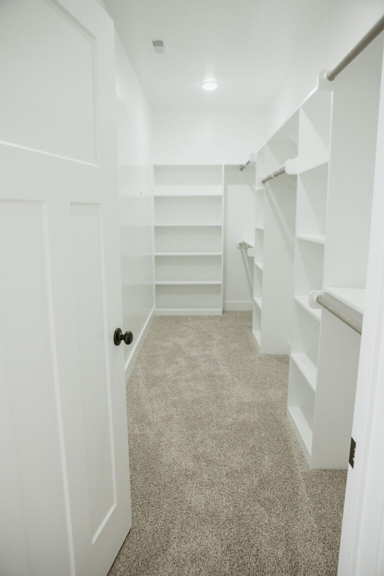 Interior primary closet view of the Tyler Home Plan, 1731 square feet built by Neuse River Homes.